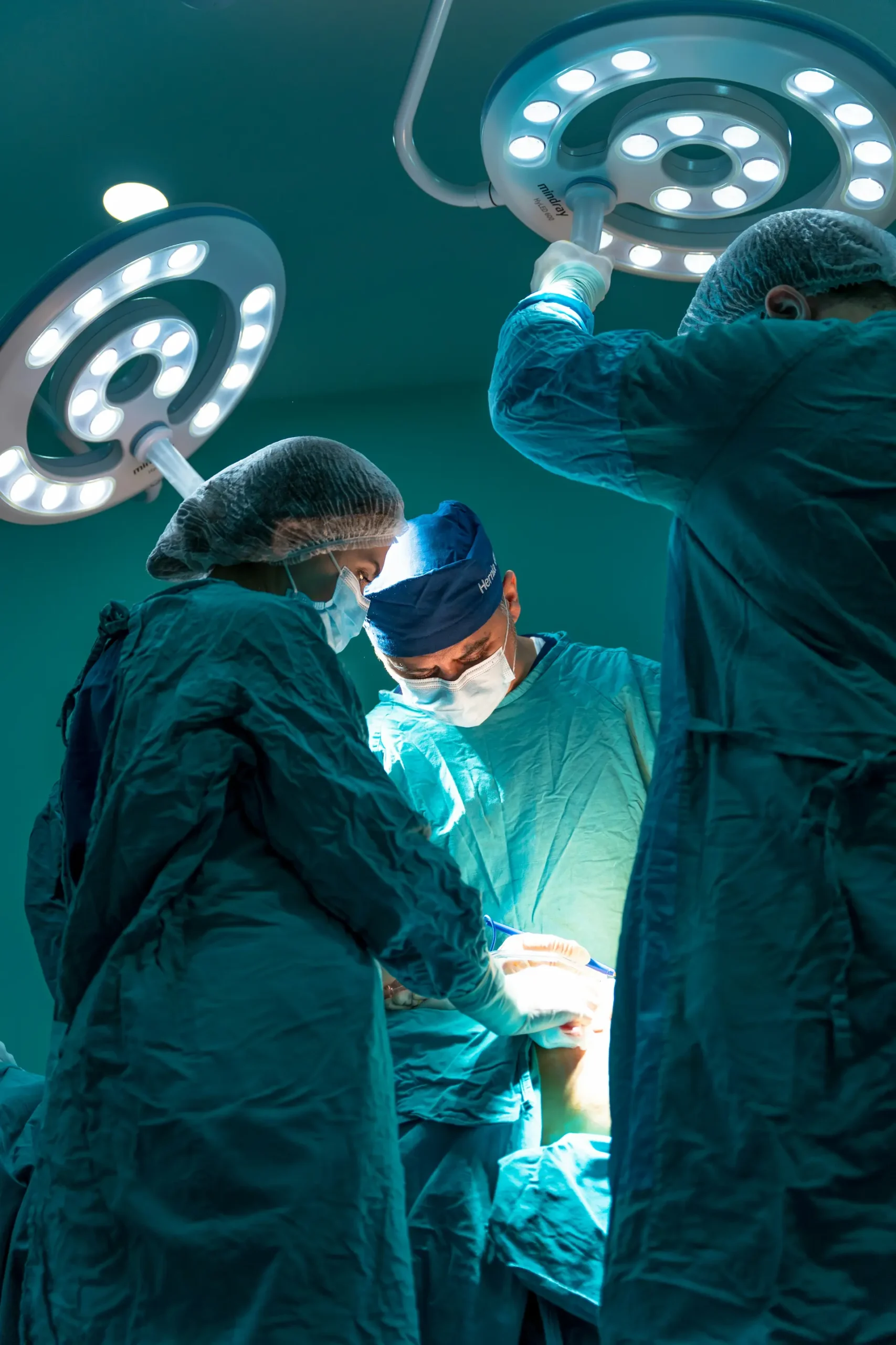 Surgeons operating on a patient