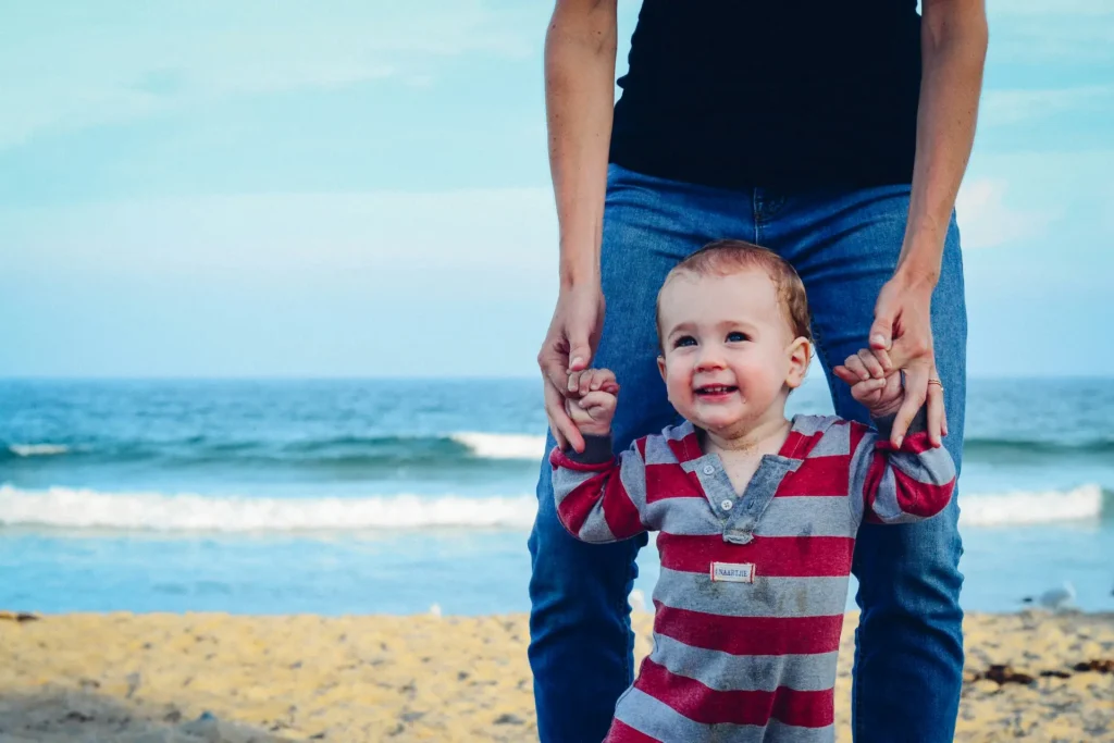 Father and young son on a beach