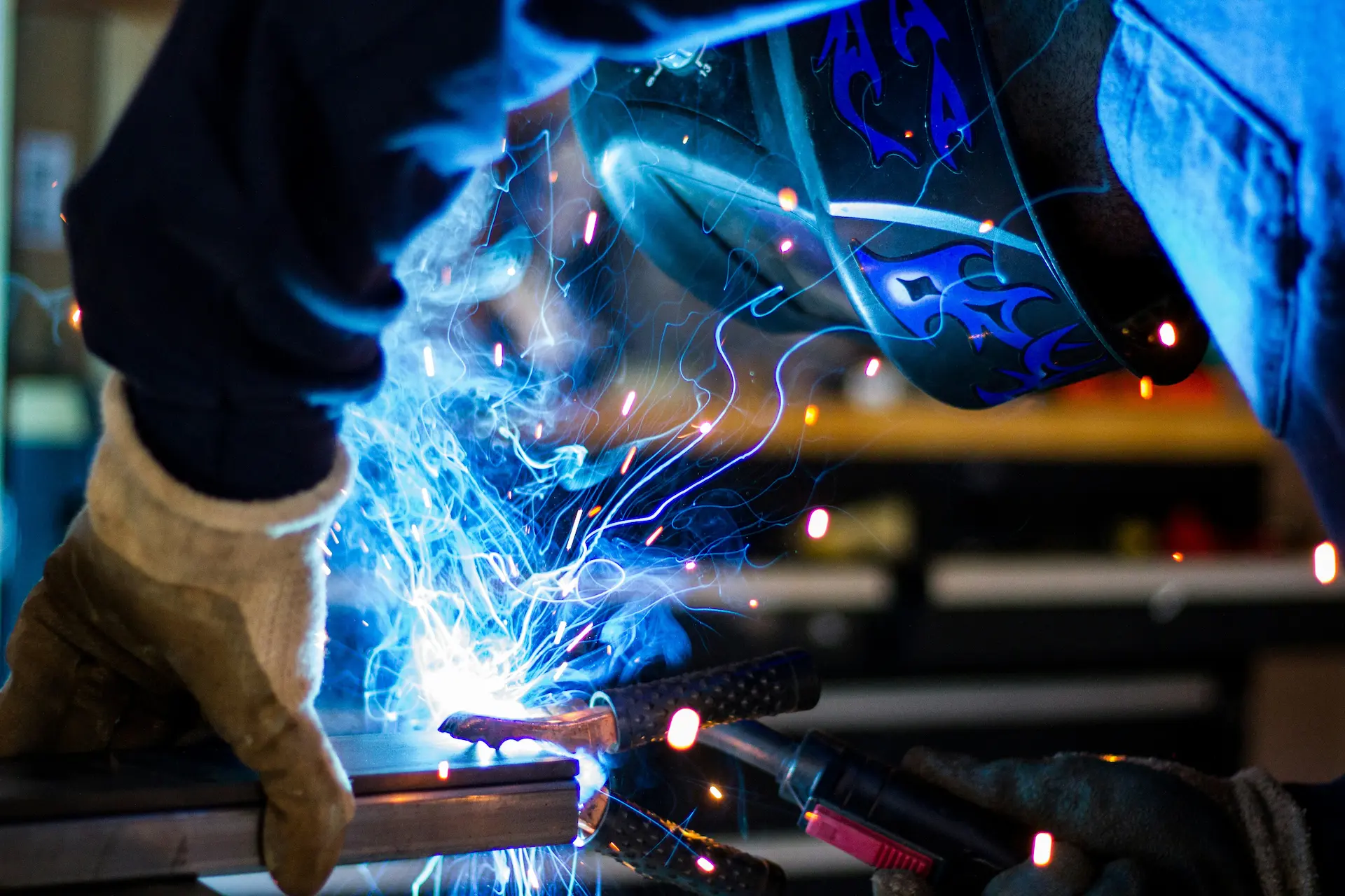 Welder working in factory environment